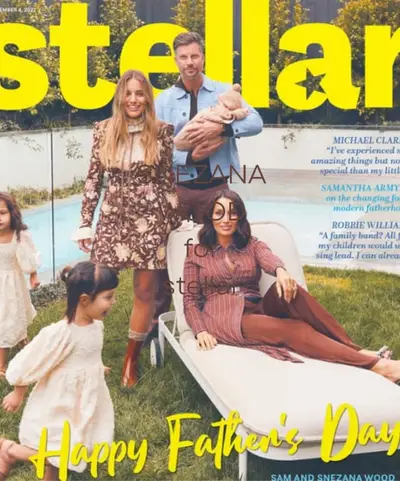 Magazine spread photographed outdoors, a family seated together on a daybed in printed dresses